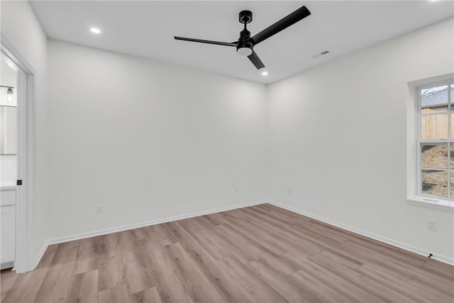 spare room with recessed lighting, light wood-style floors, visible vents, and baseboards