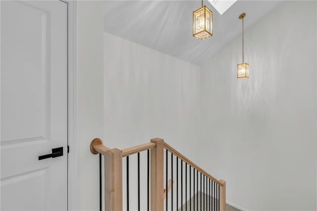 staircase featuring vaulted ceiling