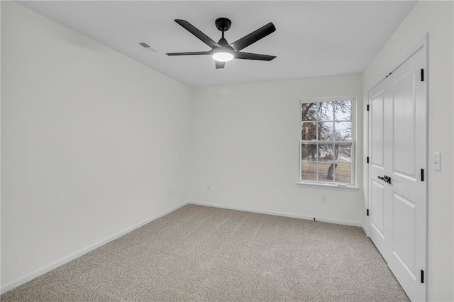 unfurnished bedroom with visible vents, a ceiling fan, baseboards, and carpet floors