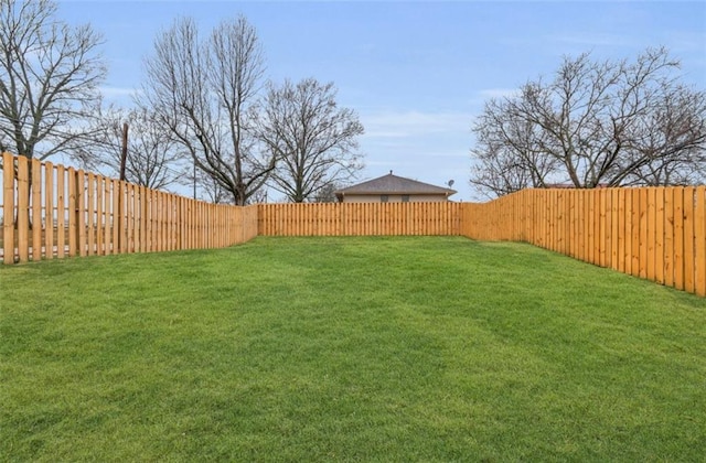 view of yard with a fenced backyard