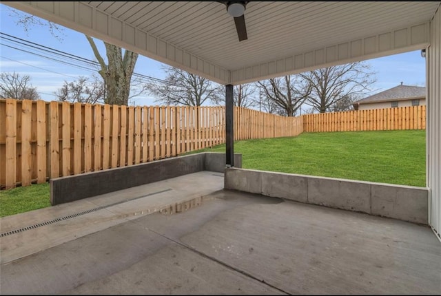 view of patio with a fenced backyard and a ceiling fan