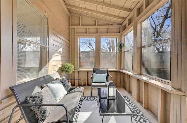 sunroom with vaulted ceiling with beams and wood ceiling