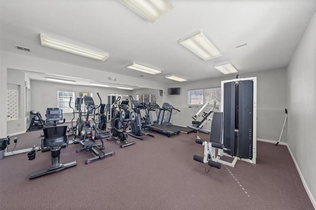 gym with visible vents and baseboards