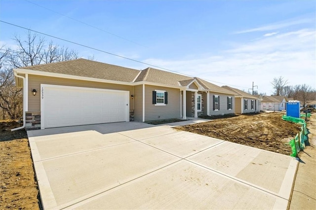 ranch-style house with driveway and an attached garage