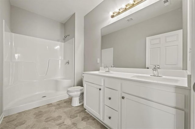 full bath featuring visible vents, a shower, and a sink