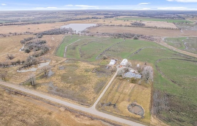 aerial view with a rural view and a water view