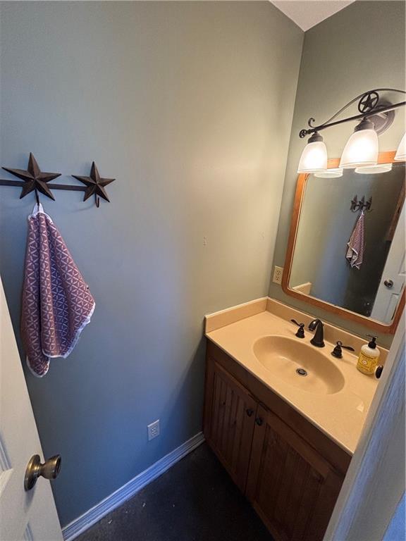 bathroom featuring vanity and baseboards