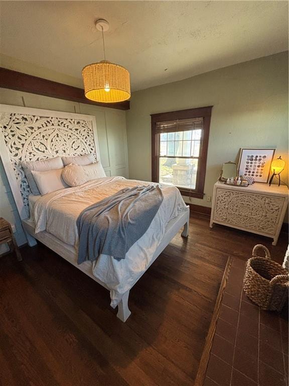 bedroom with wood finished floors