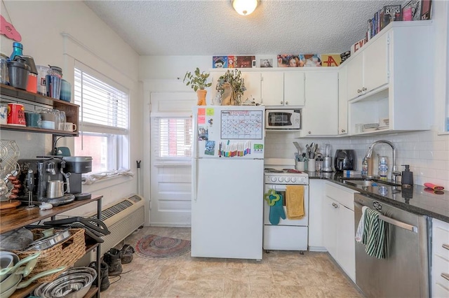 kitchen featuring white appliances, a sink, white cabinetry, backsplash, and open shelves