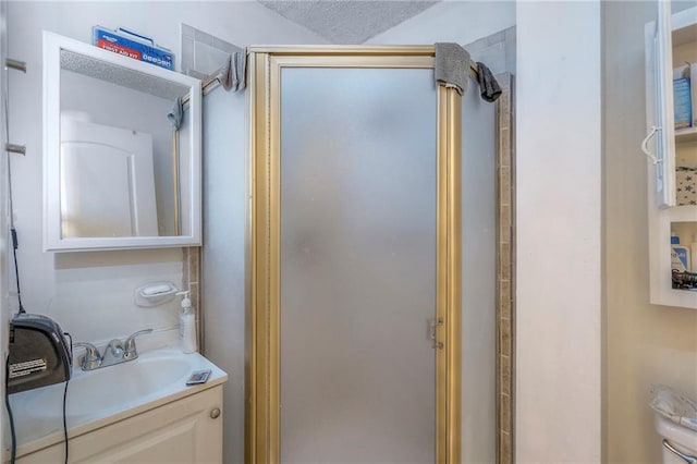 full bathroom with a stall shower and vanity