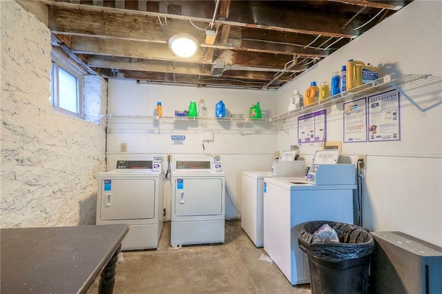 community laundry room with washing machine and clothes dryer