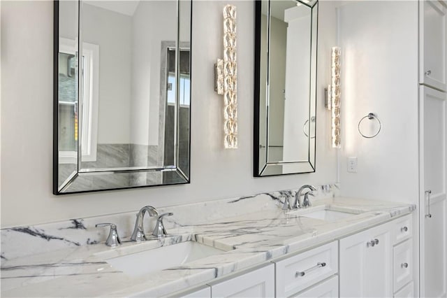 full bathroom featuring double vanity and a sink