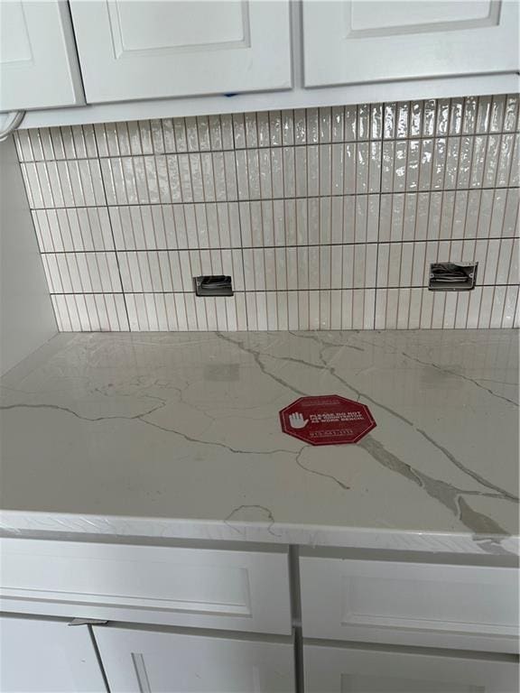 17321 Bluejacket St, Overland Park, KS 66221 - detailed view of white cabinetry and light stone counters