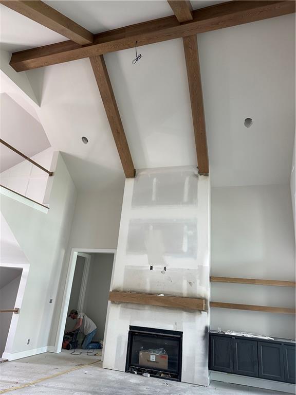 17321 Bluejacket St, Overland Park, KS 66221 - detailed view of beam ceiling and a fireplace