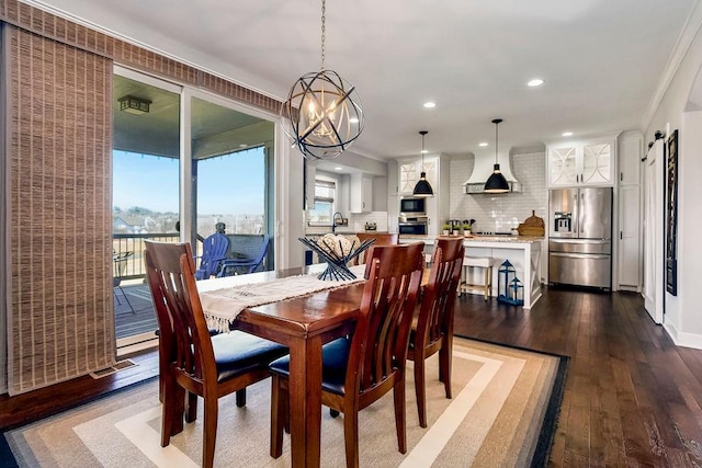 dining space with dark wood-style floors, recessed lighting, baseboards, and an inviting chandelier