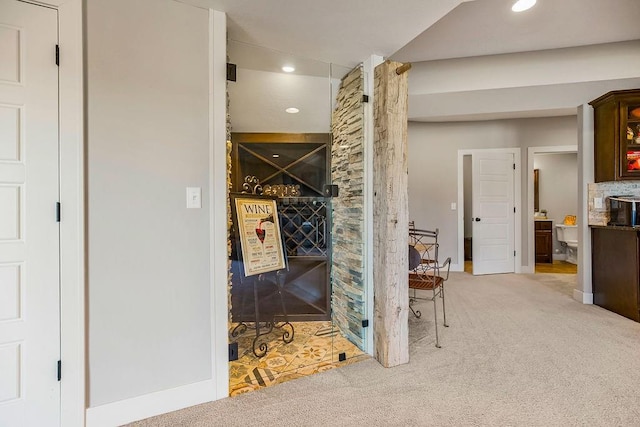 hall featuring carpet flooring and recessed lighting