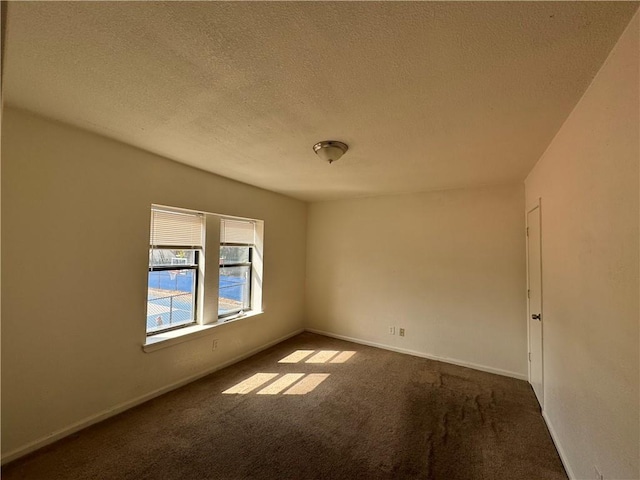 3112 Benton Blvd, Kansas City, MO 64128 - carpeted empty room with a textured ceiling and baseboards