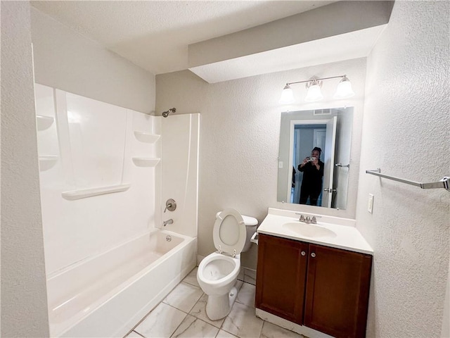 3112 Benton Blvd, Kansas City, MO 64128 - full bath with a textured wall, toilet, marble finish floor, vanity, and washtub / shower combination