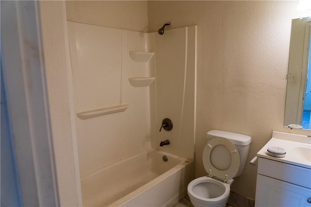 3112 Benton Blvd, Kansas City, MO 64128 - full bath featuring a textured wall, bathtub / shower combination, vanity, and toilet