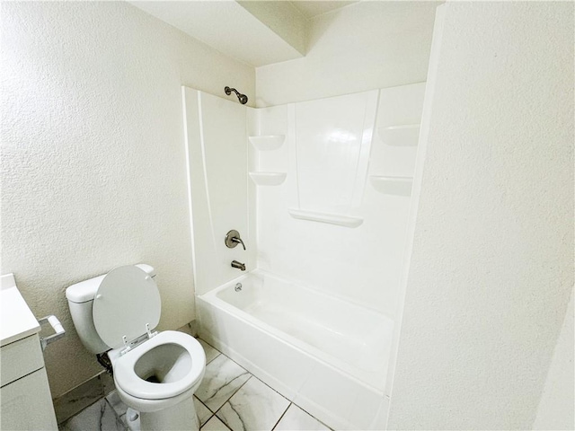 3112 Benton Blvd, Kansas City, MO 64128 - bathroom with shower / washtub combination, marble finish floor, a textured wall, toilet, and vanity