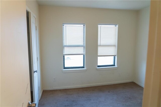 3112 Benton Blvd, Kansas City, MO 64128 - unfurnished room with carpet flooring and baseboards