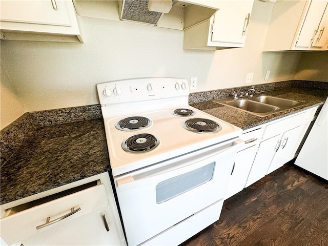 3112 Benton Blvd, Kansas City, MO 64128 - kitchen with extractor fan, electric range, dark wood-type flooring, a sink, and dark countertops