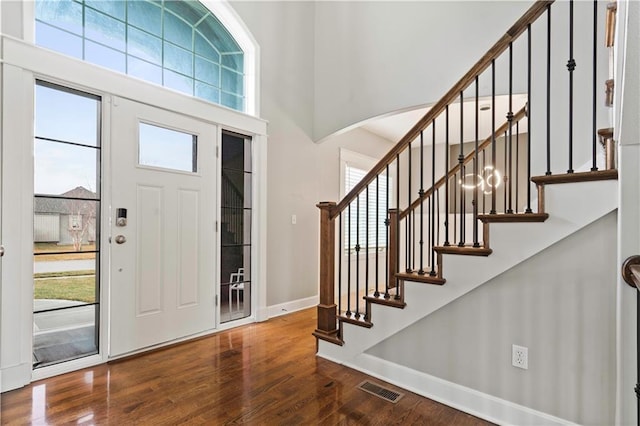 entryway featuring a wealth of natural light, visible vents, and wood finished floors