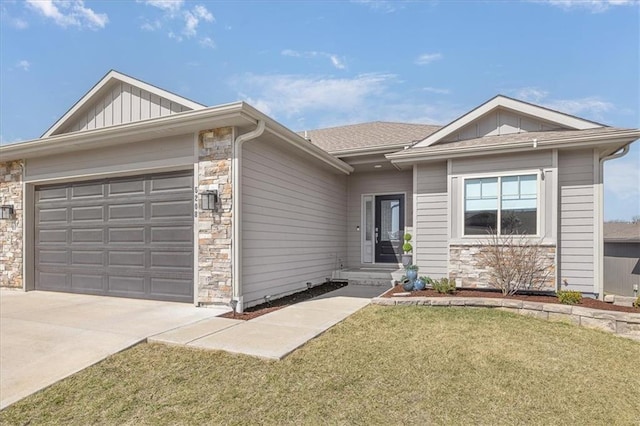 ranch-style home with concrete driveway, board and batten siding, a front yard, a garage, and stone siding