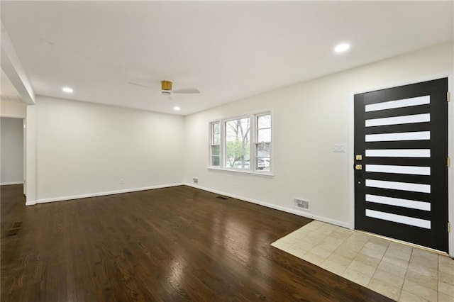 entryway featuring recessed lighting, wood finished floors, visible vents, and baseboards