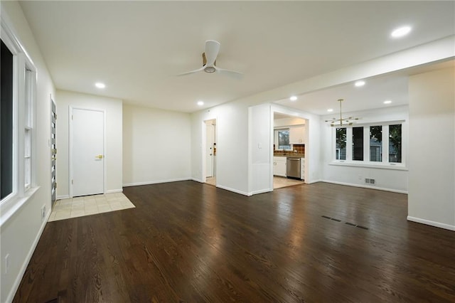 unfurnished living room featuring baseboards, visible vents, a ceiling fan, wood finished floors, and recessed lighting