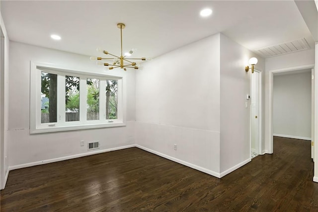 unfurnished room with a chandelier, wood finished floors, and recessed lighting