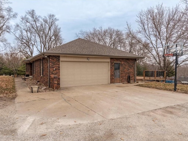 garage featuring driveway