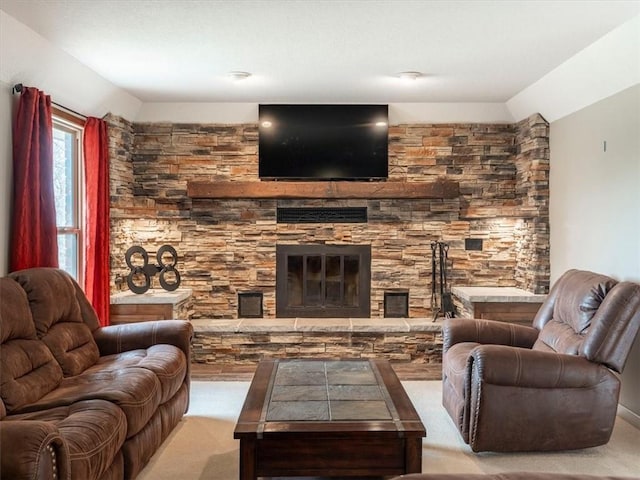 living area featuring carpet floors, a fireplace, and vaulted ceiling