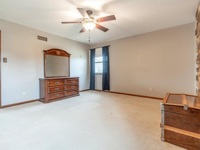 unfurnished bedroom featuring visible vents, baseboards, a ceiling fan, and carpet flooring