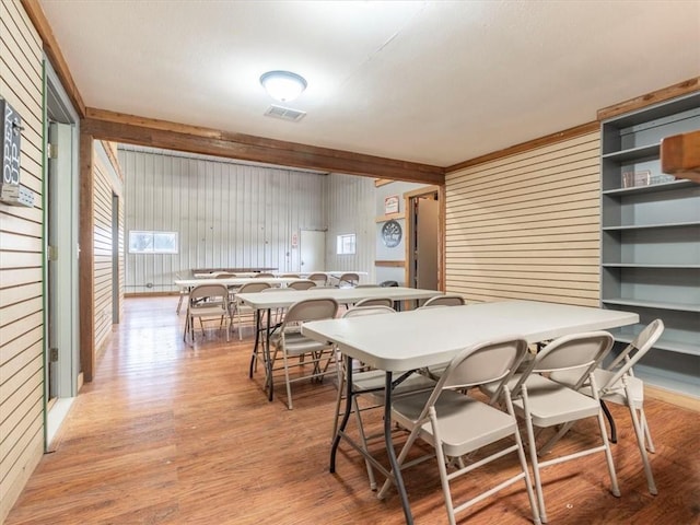 dining room featuring visible vents and light wood finished floors