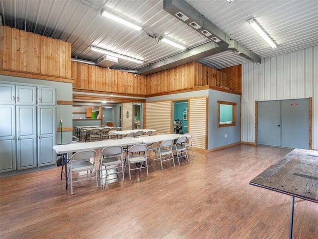 kitchen featuring wood finished floors and metal wall