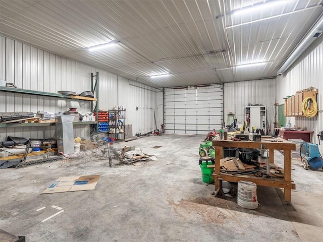 garage with a workshop area and metal wall