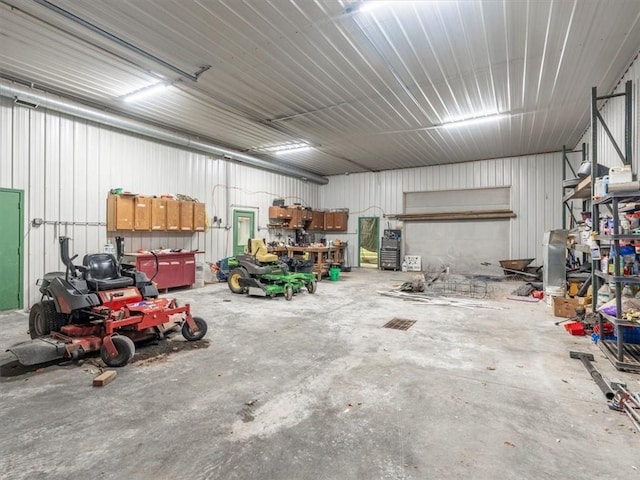 garage with metal wall and a workshop area