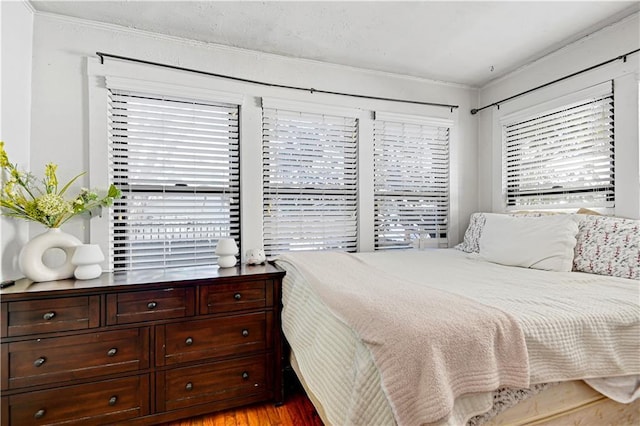 bedroom with light wood finished floors