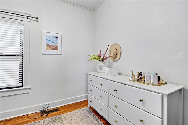 interior space featuring wood finished floors and baseboards