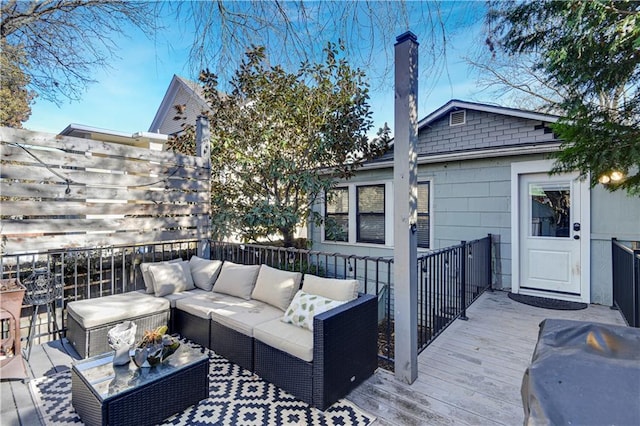 wooden deck featuring an outdoor hangout area