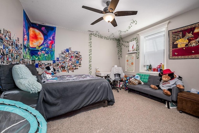 bedroom with carpet, visible vents, and a ceiling fan