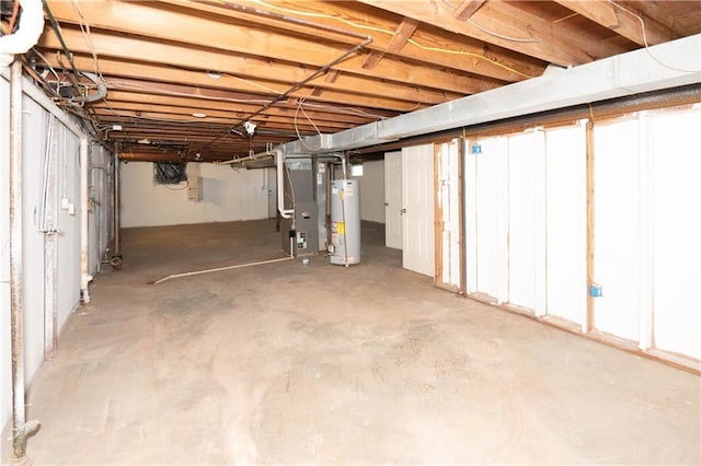 unfinished basement with heating unit and gas water heater