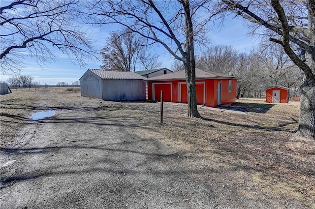 view of side of property with an outbuilding and a pole building