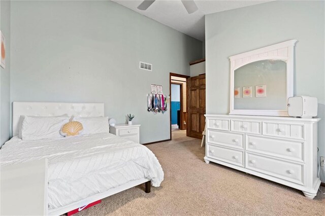 bedroom featuring vaulted ceiling, a ceiling fan, visible vents, and carpet floors