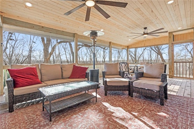 view of patio / terrace with an outdoor living space, a ceiling fan, and a wooden deck