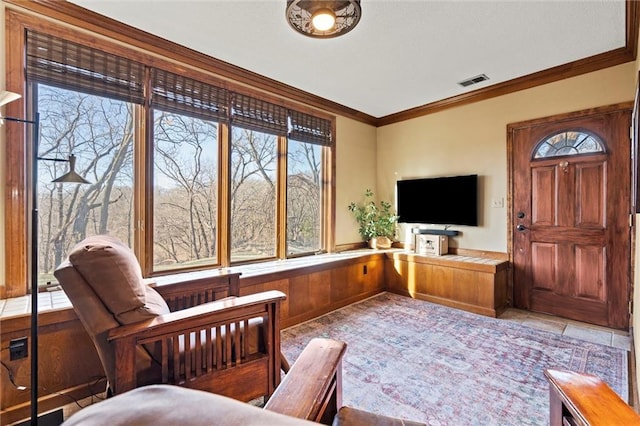 living room with crown molding and visible vents