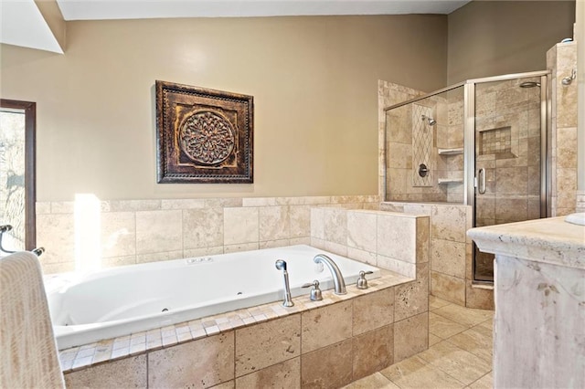 bathroom featuring a shower stall and a jetted tub