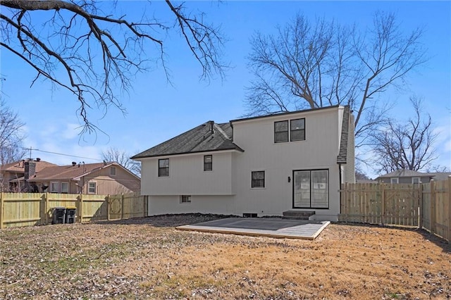 back of house featuring a patio area and a fenced backyard