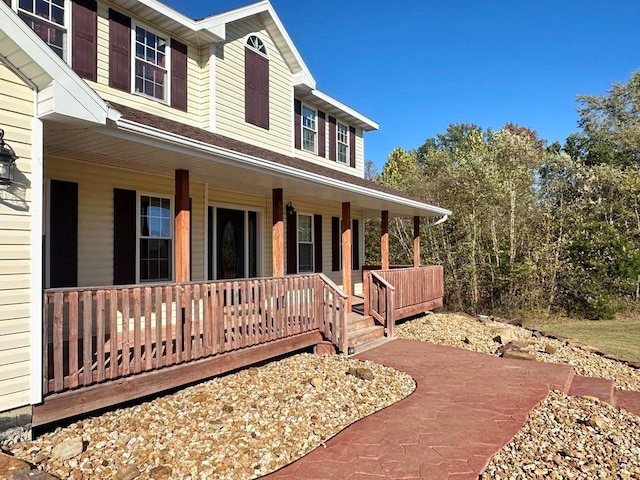 view of side of property featuring a porch